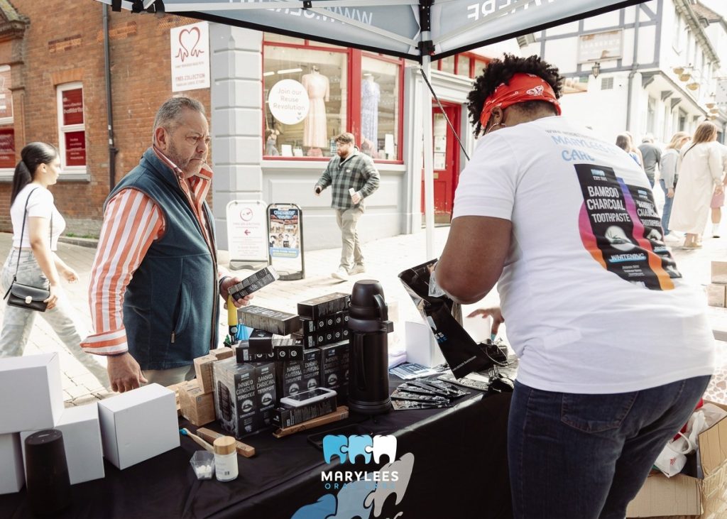 Busy market stall interaction